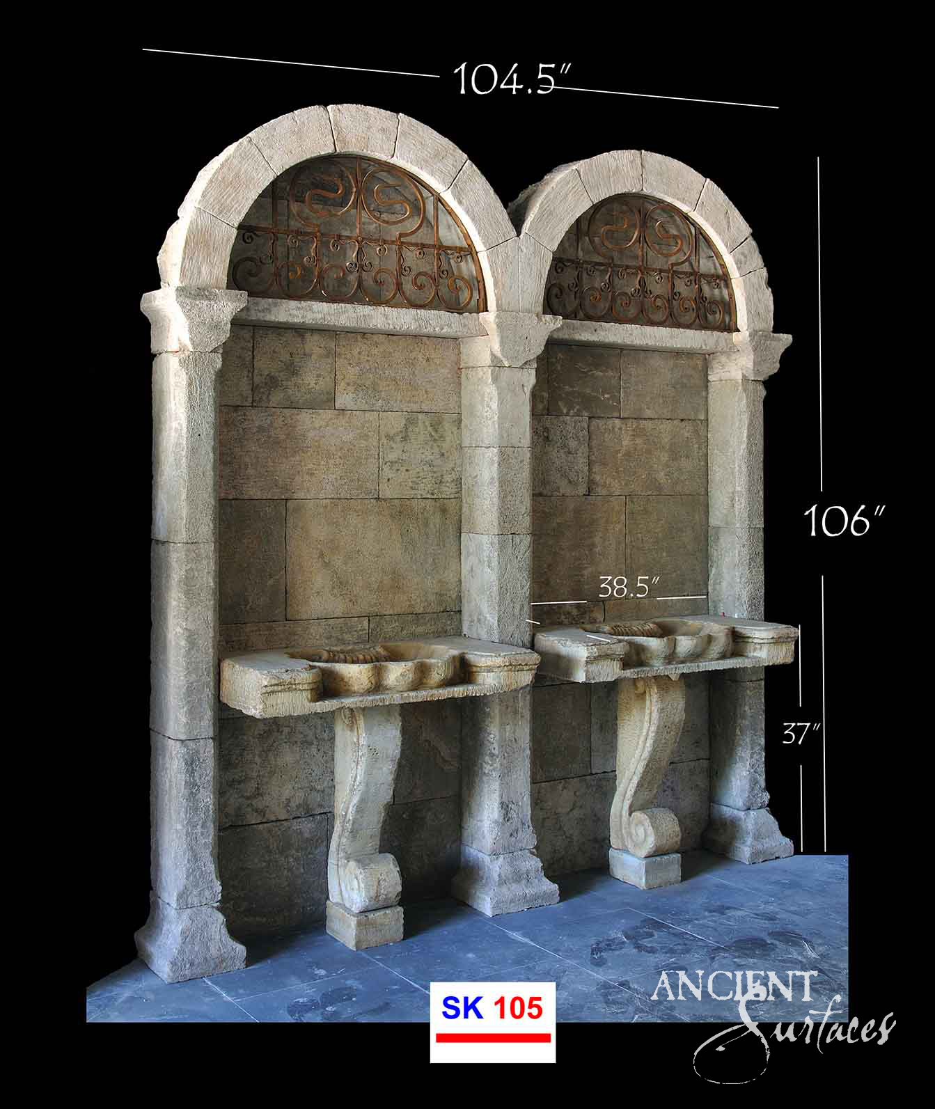 Monumental twin-arch reclaimed limestone lavabo with iron grilles above two stone sink shelves